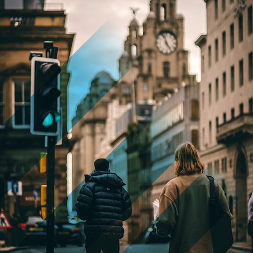 Buildings in Liverpool city centre and a traffic light on green